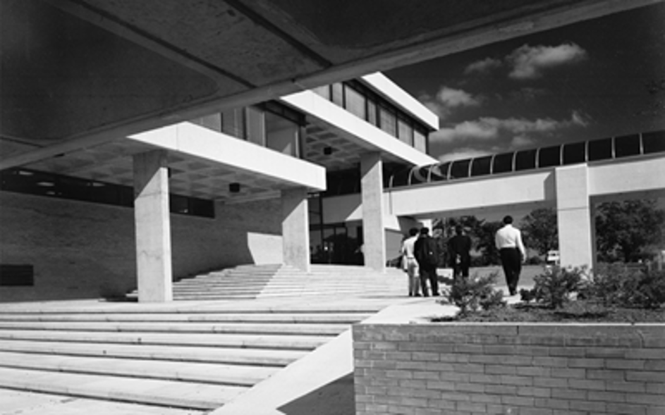 Black and white photograph of concrete steps and buildings